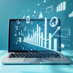 Laptop wyświetlający wykresy i dashboard analizy danych symbolizujące pracę analityka danych.